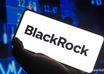 January 12, 2022, Brazil. In this photo illustration the BlackRock logo displayed on a smartphone screen and a stock market graph in the background